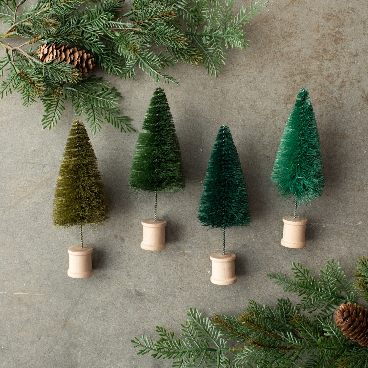 Set of 4 Green Bottlebrush Trees w/Spool Base